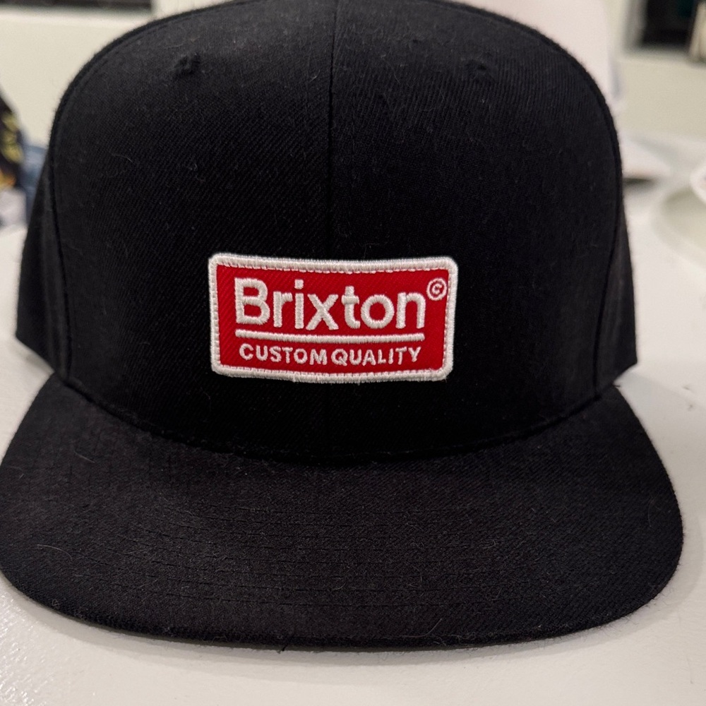 Brixton Black Hat with Red Emblem